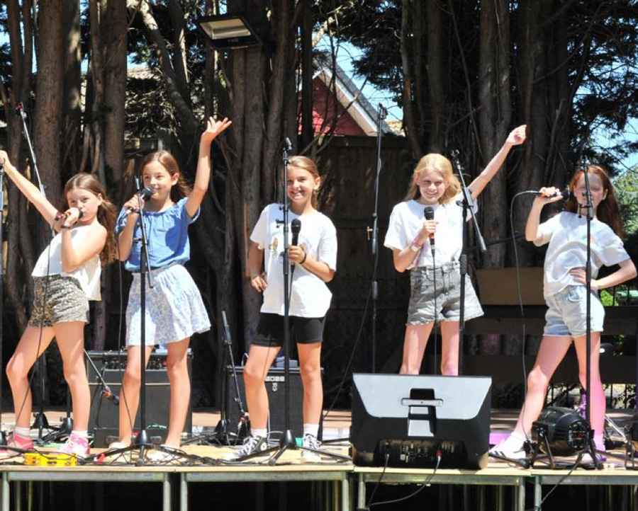 Group of young child performing on stage